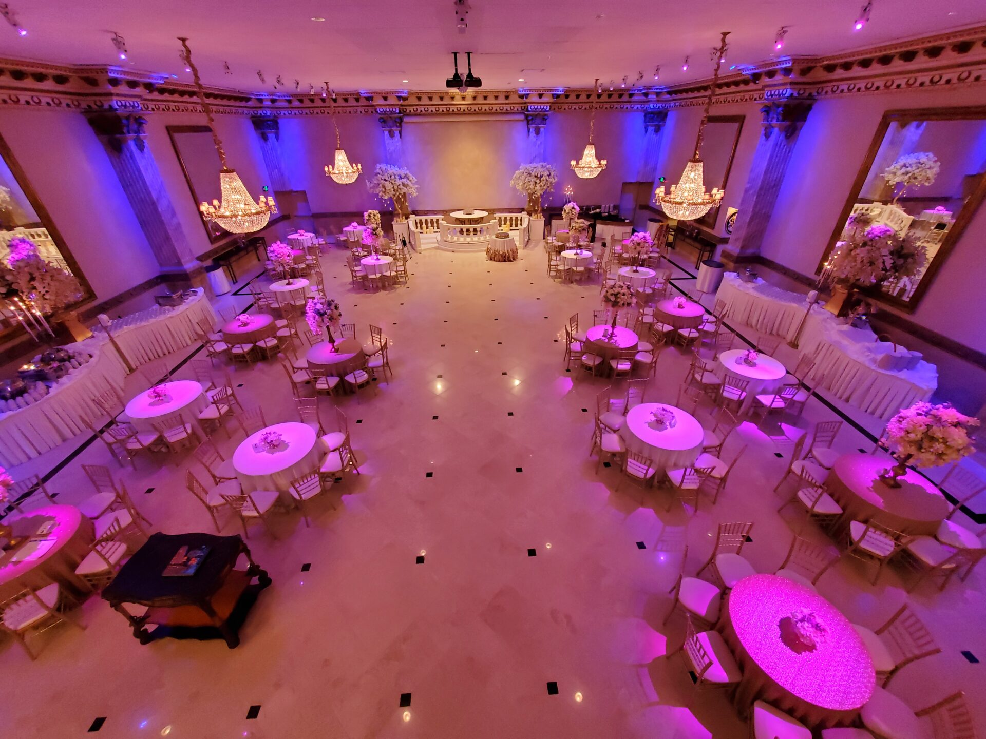 Header image of ballroom with colored lighting