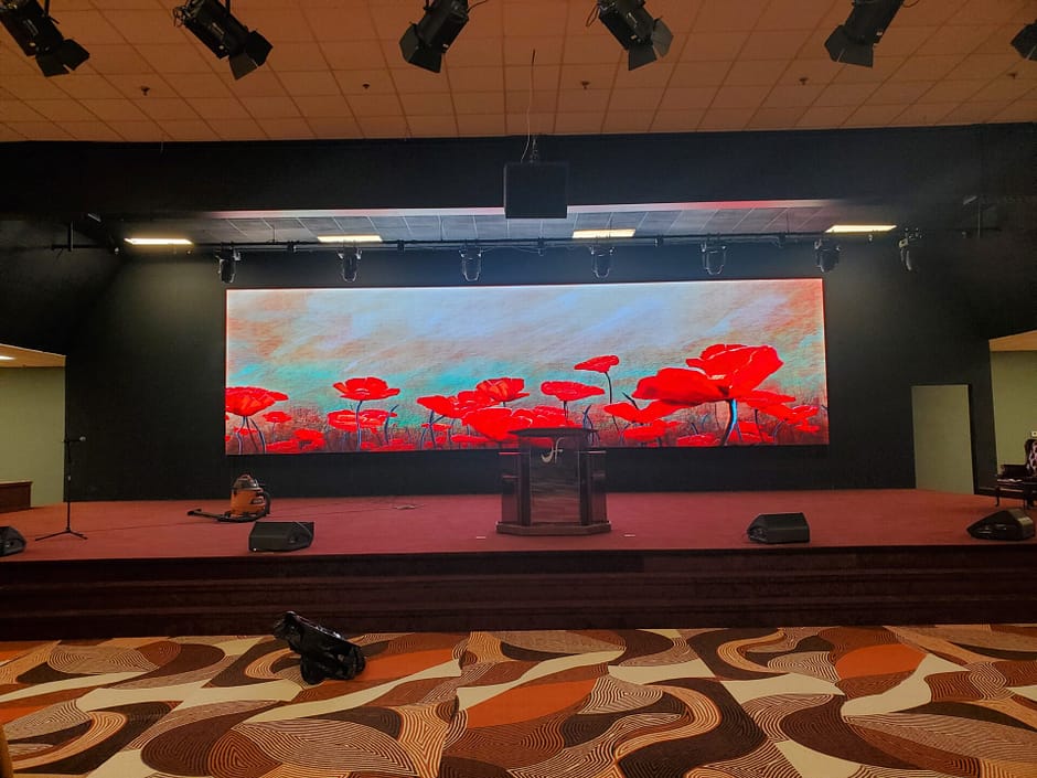 Flowers on Video Wall behind Church Stage