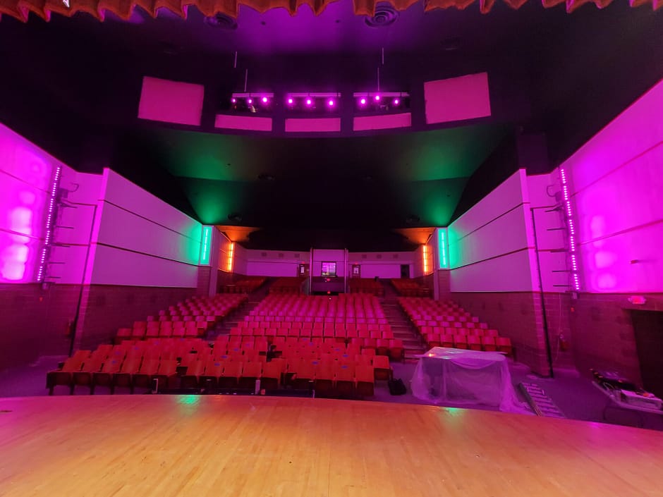 Auditorium with Purple and Green Lighting