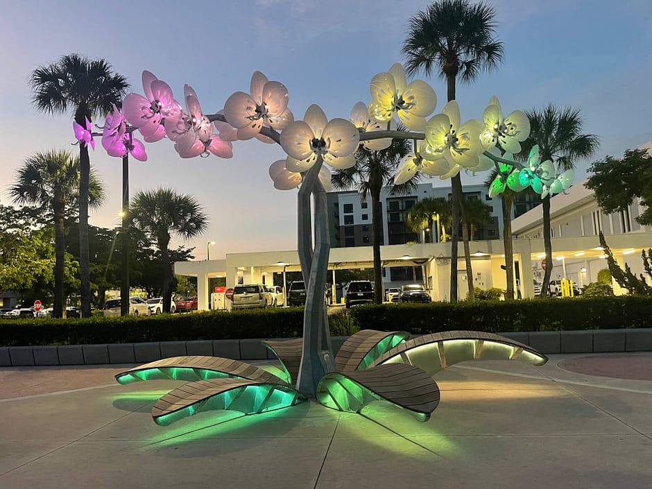Floral sculpture lit up in multiple colors